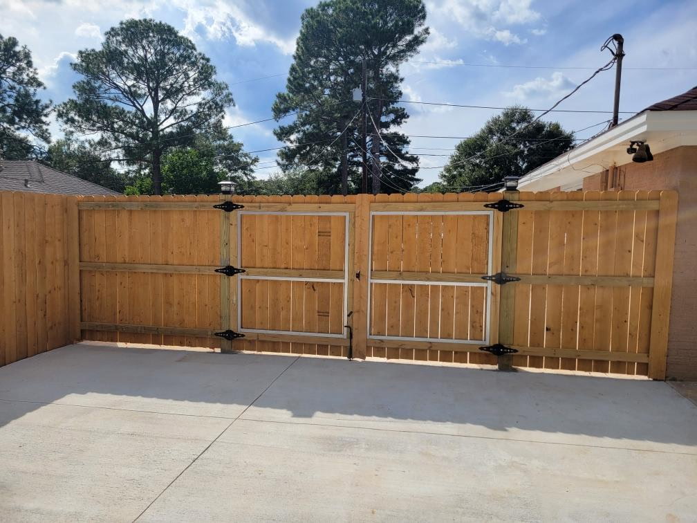 Real Bravo Fence wood privacy fence with double gates installed at an Alabama home